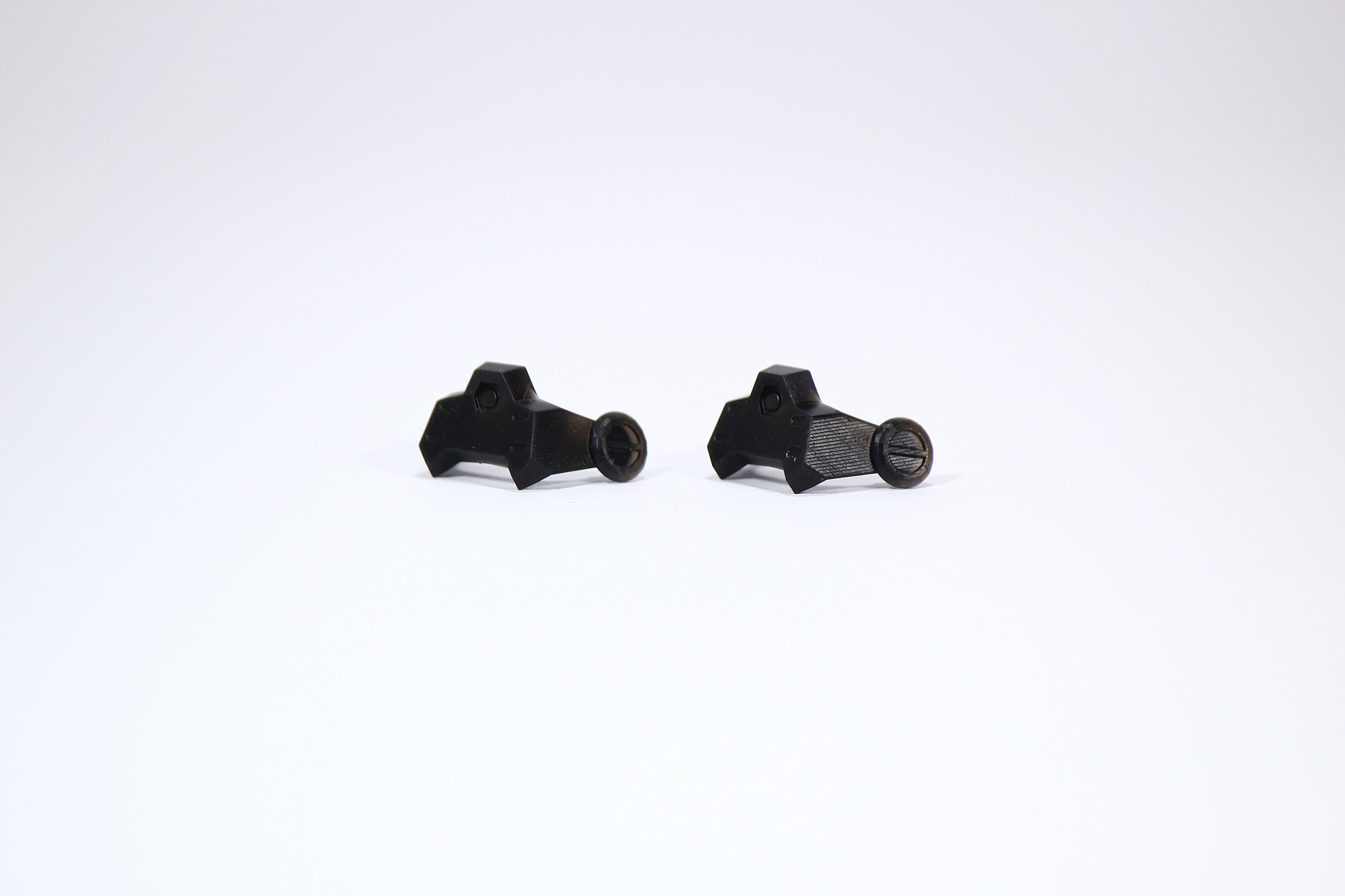 Multiple resin printed Monolith Optics components showing normal differences in surface texture